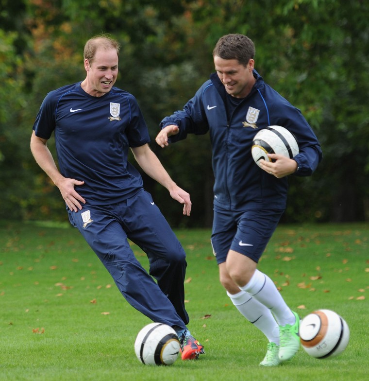 Image: Britain's Prince William trains with former England international footballer, Michael Owen, in the grounds of Buckingham Palace, in central London